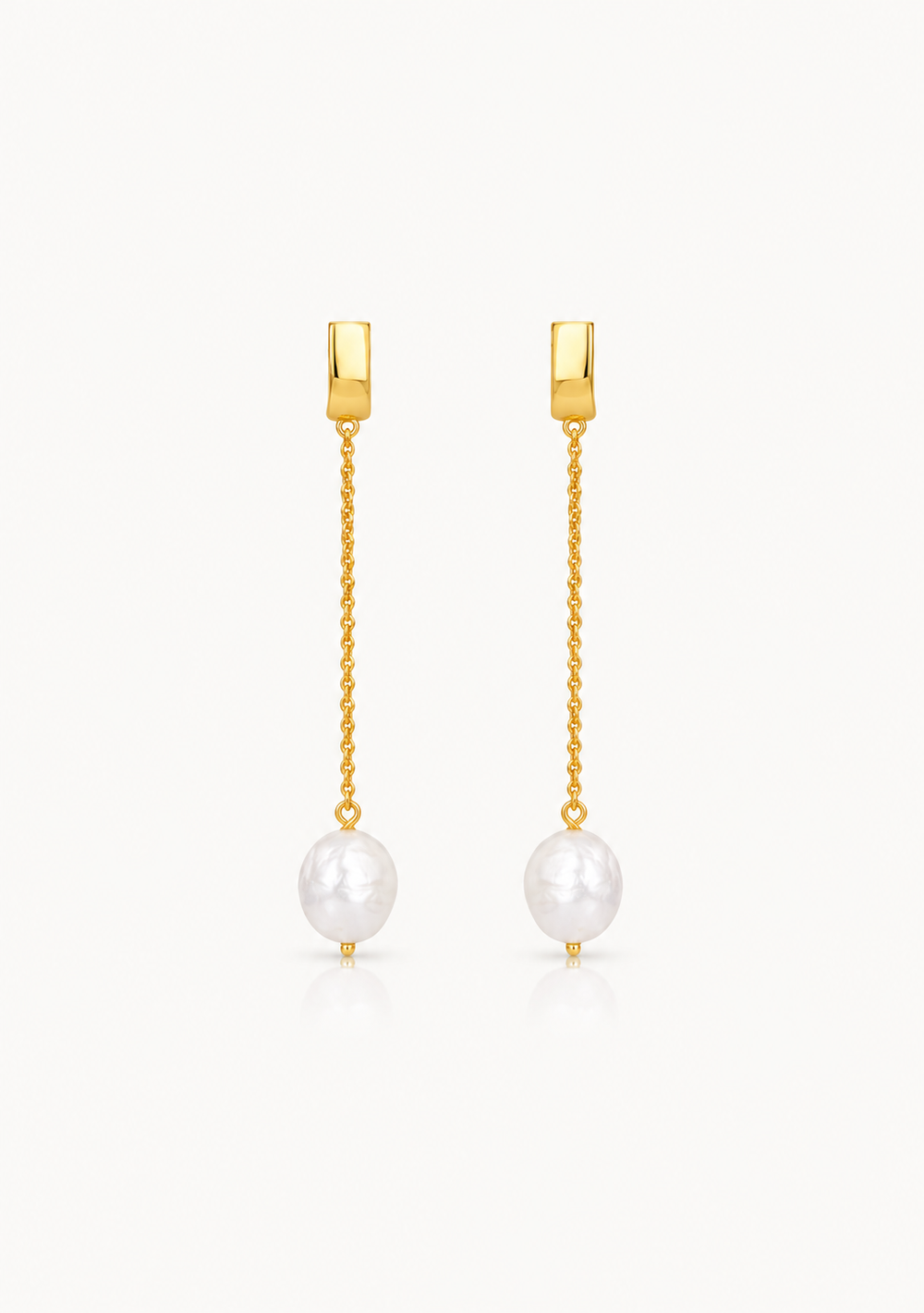 A pair of gold drop earrings with a rectangular post, a delicate chain, and a dangling white pearl, shown on a clean white background.