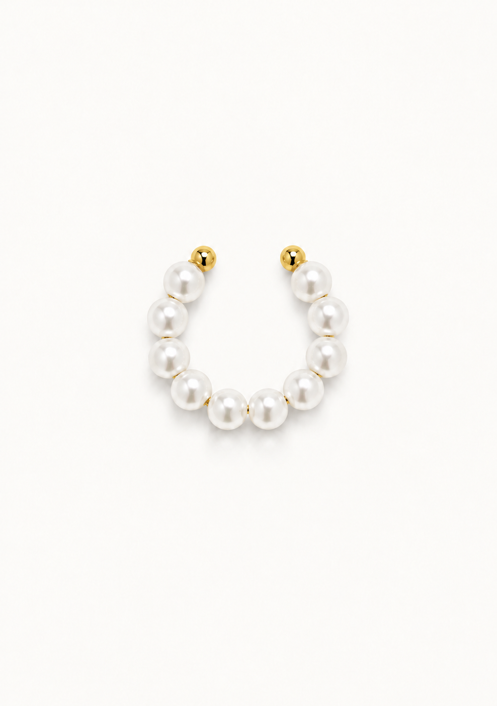 A gold-plated U-shaped hoop earring adorned with a row of white freshwater pearls, shown against a plain white background.