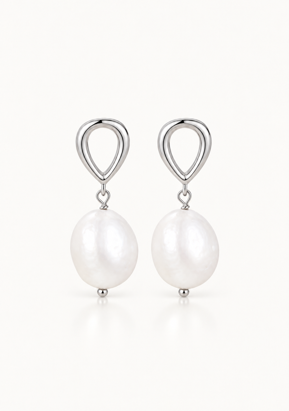 Minimal silver and pearl wedding earrings for the modern bride.