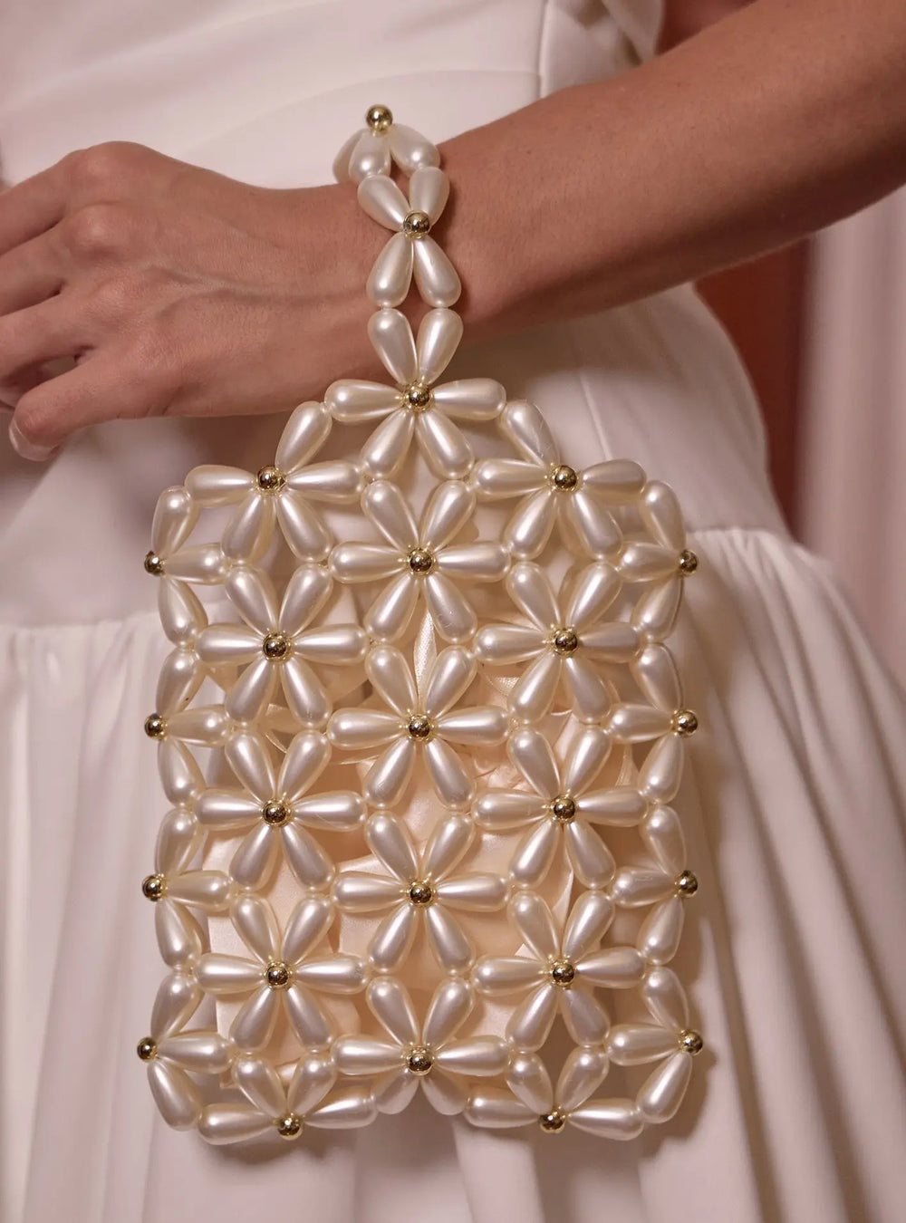 Modern bridal bag designed to complement pearl earrings, wedding gowns and bridal reception looks