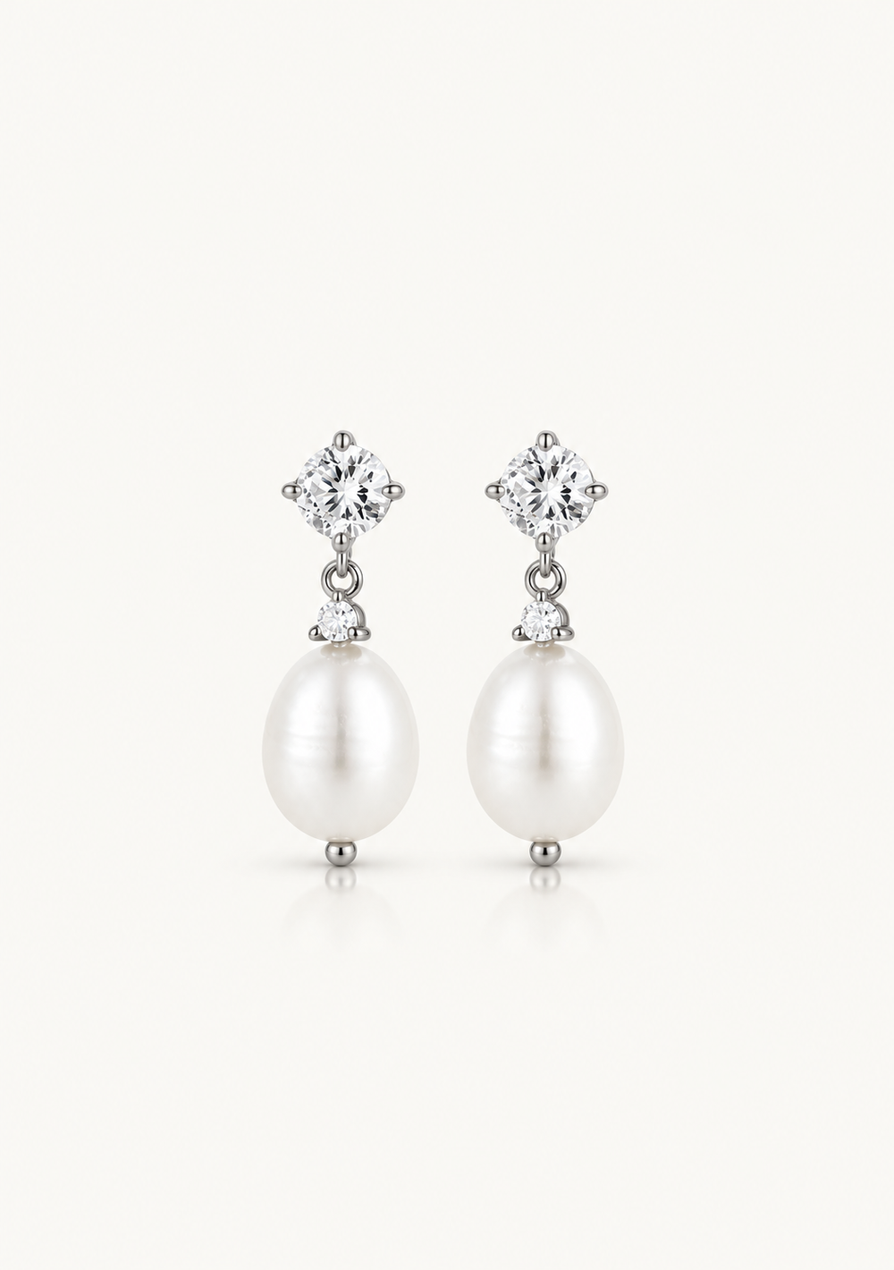 Modern pearl and crystal silver wedding earrings for the modern bride to be 