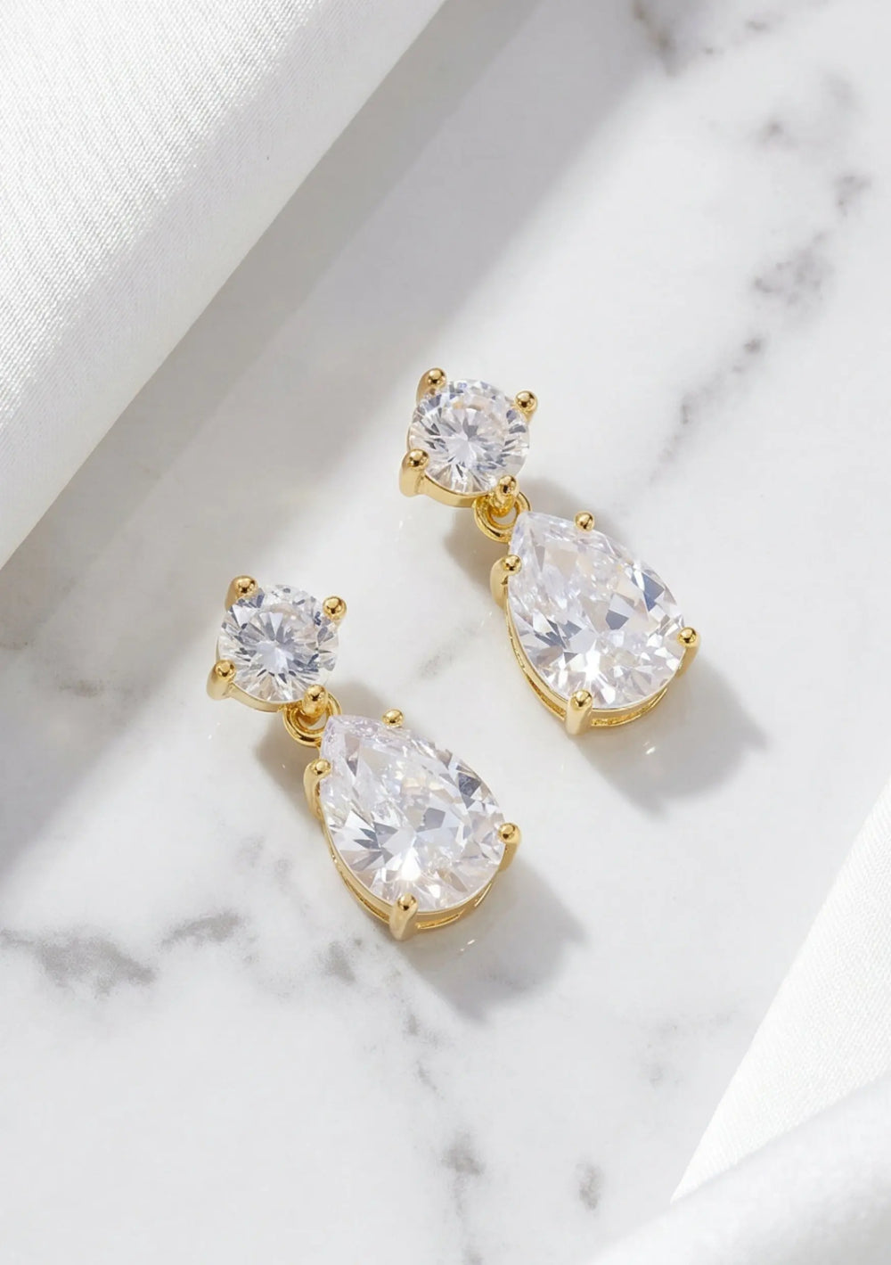 Carmen crystal drop bridal earrings in 18K gold featuring sparkling cubic zirconia stones by Lolaknight
