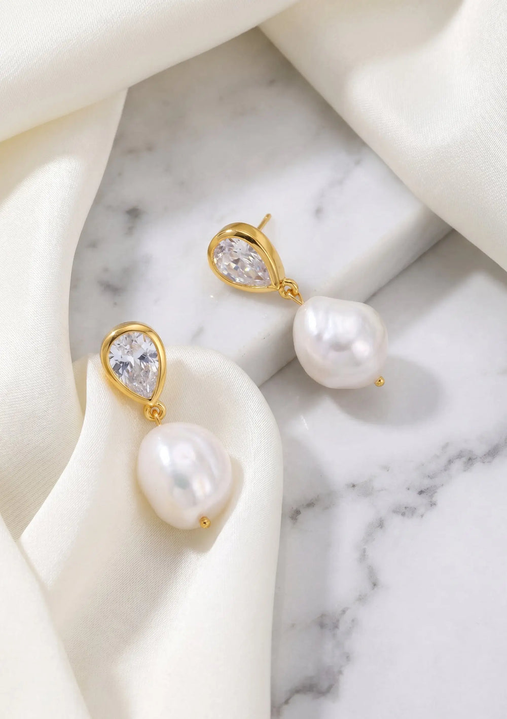 Oceane pearl bridal earrings in 18K gold featuring cubic zirconia crystals and freshwater pearls by Lolaknight