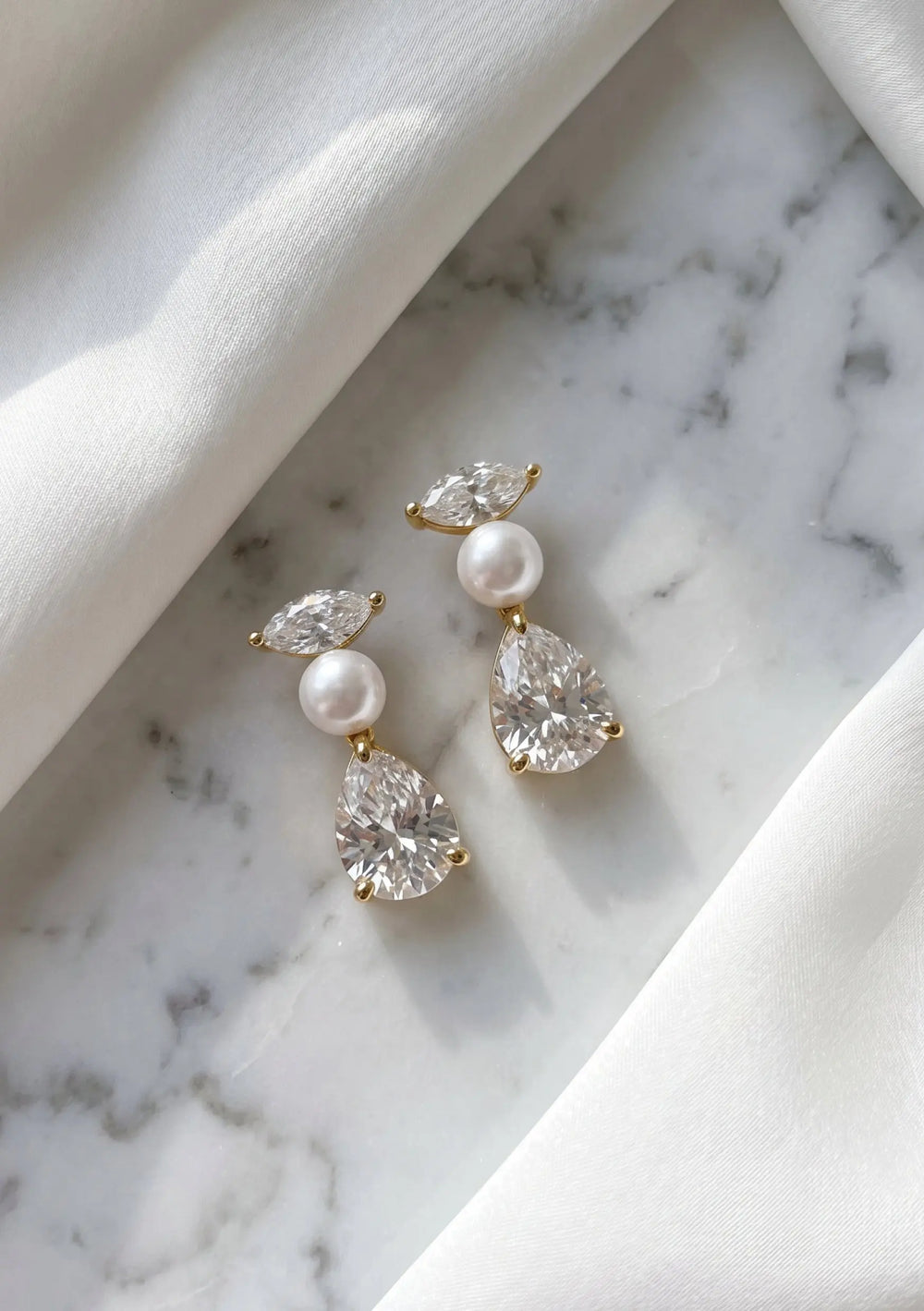 Estella crystal pearl drop bridal earrings in 18K gold designed for modern brides by Lolaknight