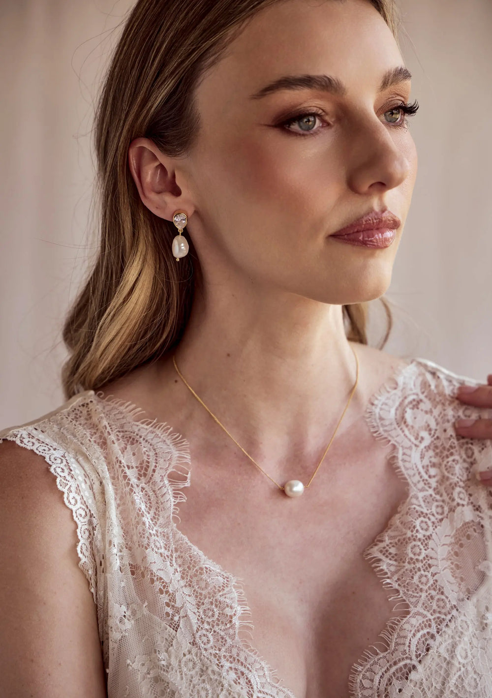 Oceane wedding earrings in 18K gold featuring statement freshwater pearls and cubic zirconia crystals