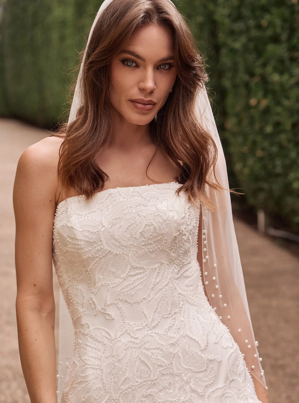 Ivory pearl cathedral veil with elegant pearl detailing for wedding ceremonies and bridal receptions