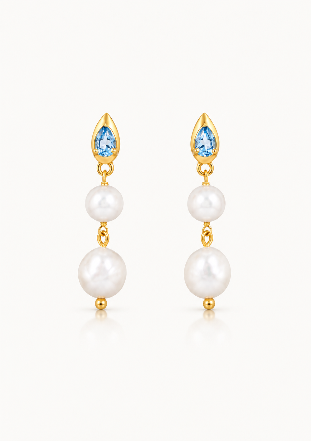 Lulu 18K gold wedding earrings with blue topaz pear gemstones and baroque pearls by Lola Knight
