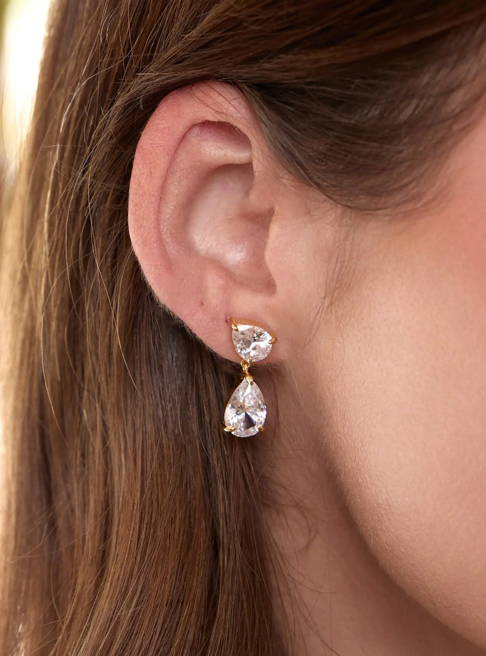 Aura crystal bridal earrings in 18K gold featuring pear shaped cubic zirconia crystals by Lolaknight.