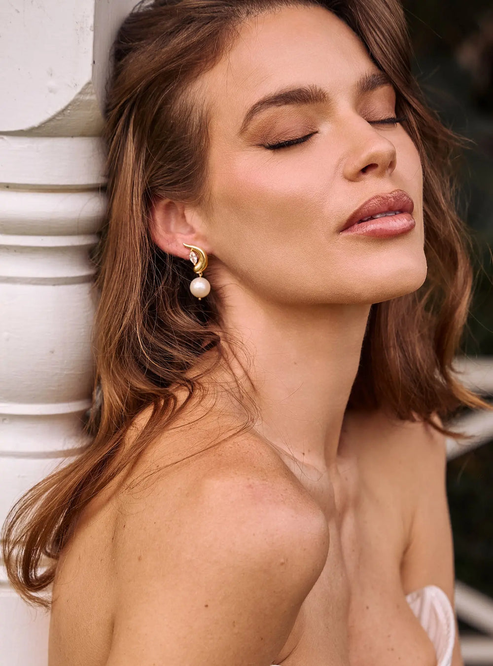 Luxury crystal bridal earrings in 18K gold featuring marquise shaped cubic zirconia crystals by Lolaknight