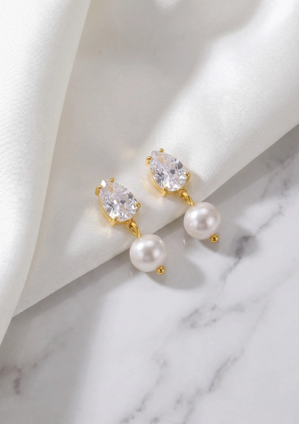 Modern gold pearl drop earrings perfect for wedding day jewellery looks