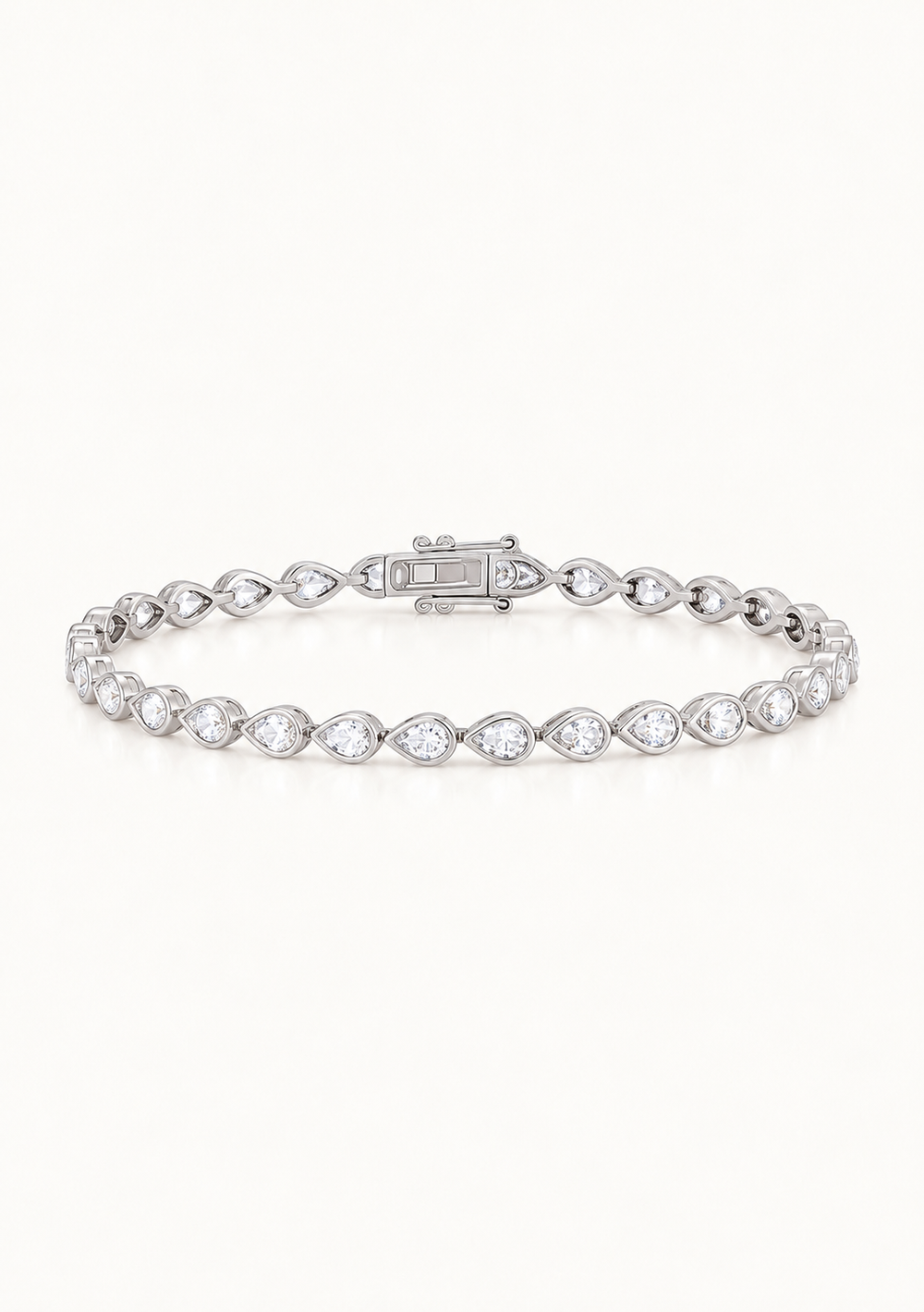 Luxury silver crystal tennis bracelet for the modern bride. This is a chic pear bezel tennis bracelet.