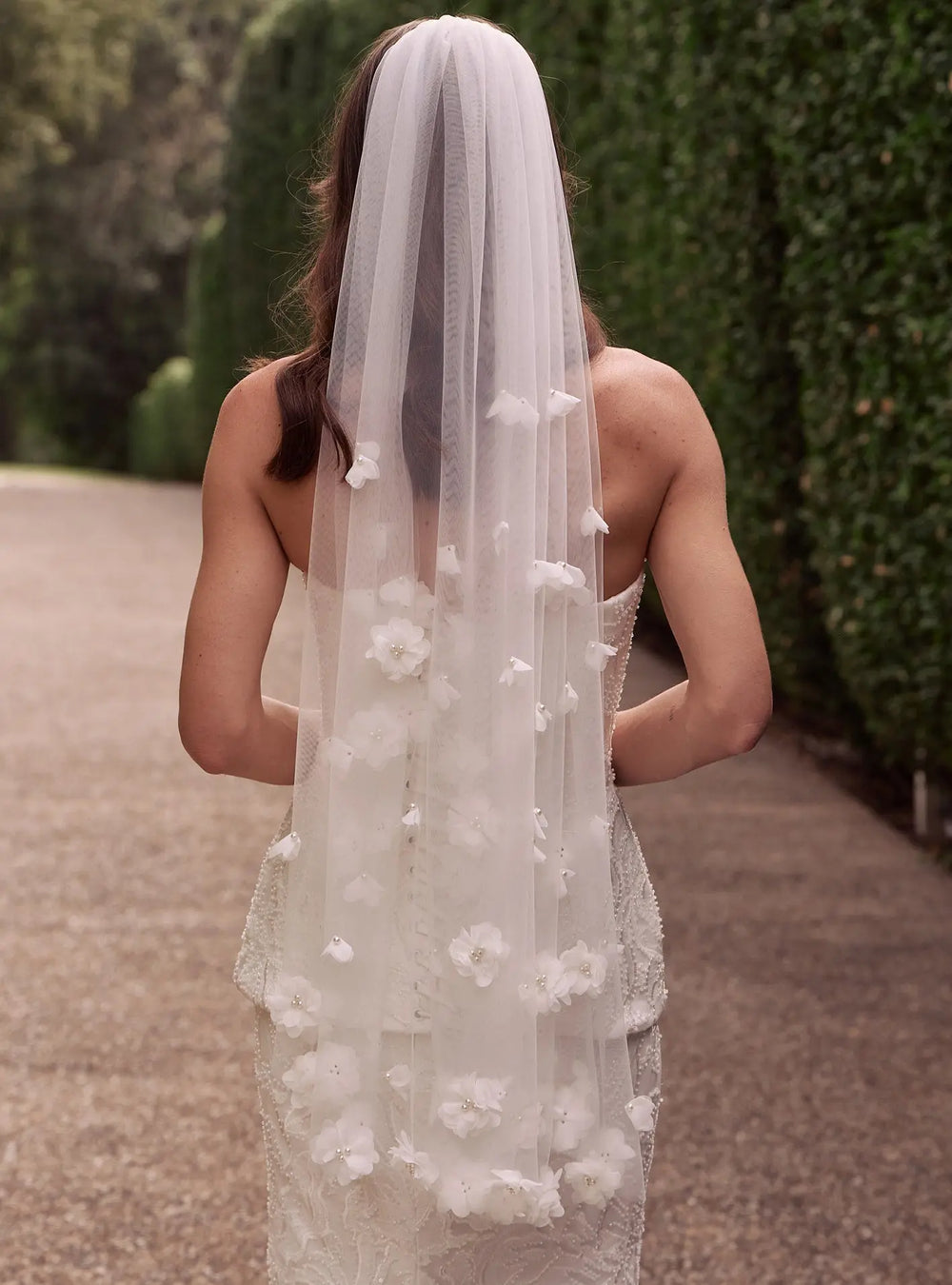Romantic ivory pearl veil featuring delicate pearl accents for bridal ceremonies and wedding portraits