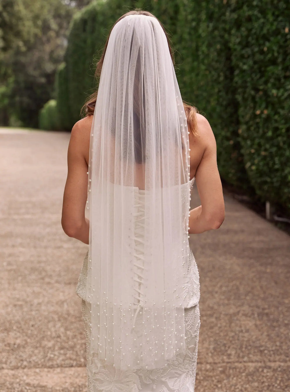 Ivory pearl bridal veil featuring delicate pearl embellishments and soft tulle for modern wedding styling by Lolaknight
