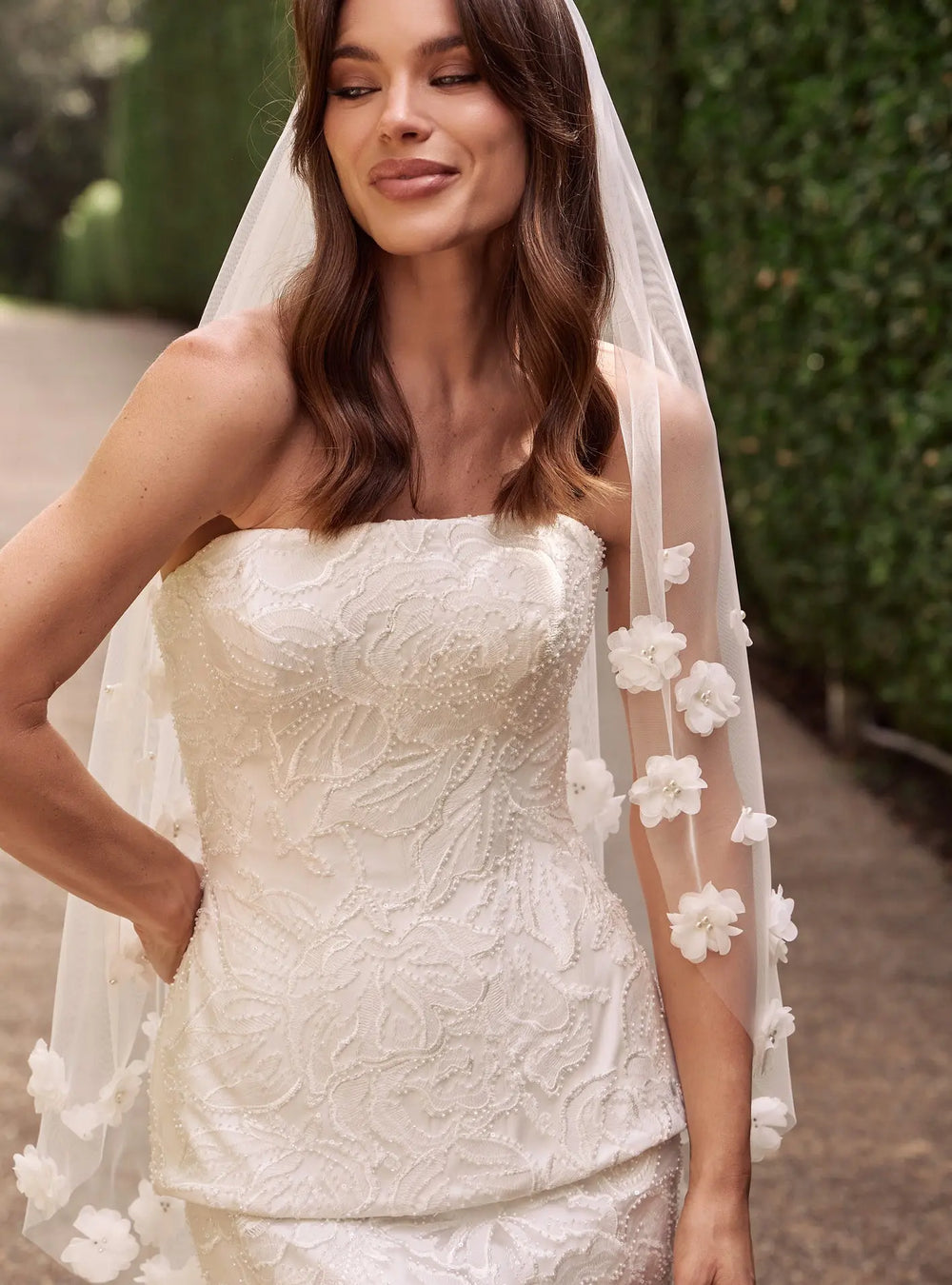 Romantic ivory pearl veil featuring delicate pearl accents for bridal ceremonies and wedding portraits