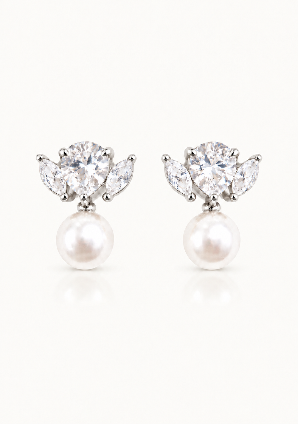 Maris statement bridal drop earrings in silver with pear cut crystals and pearl detailing by Lolaknight