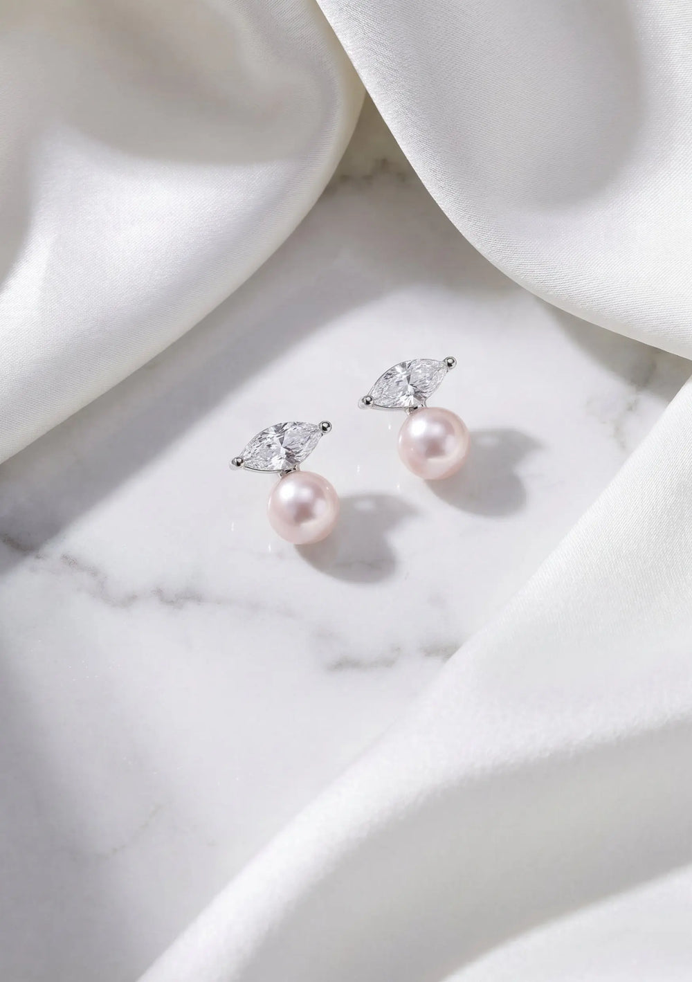 Esme crystal and pearl bridal stud earrings in silver featuring freshwater pearls and marquise cubic zirconia by Lolaknight