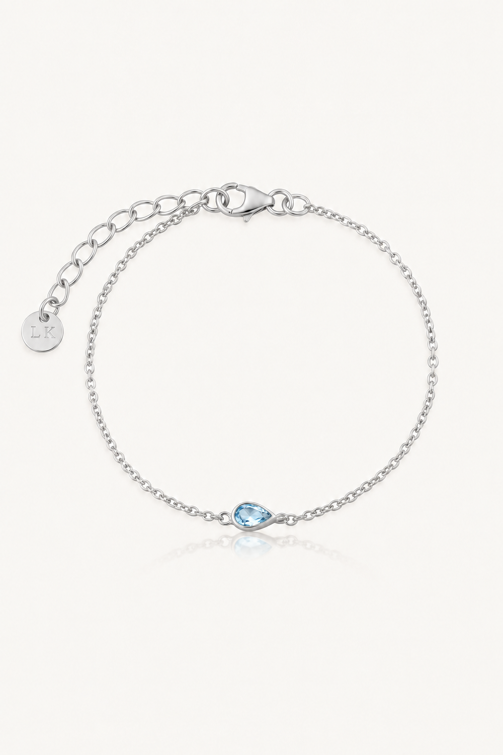 Something blue bridal bracelet in silver with bezel-set blue topaz by Lola Knight