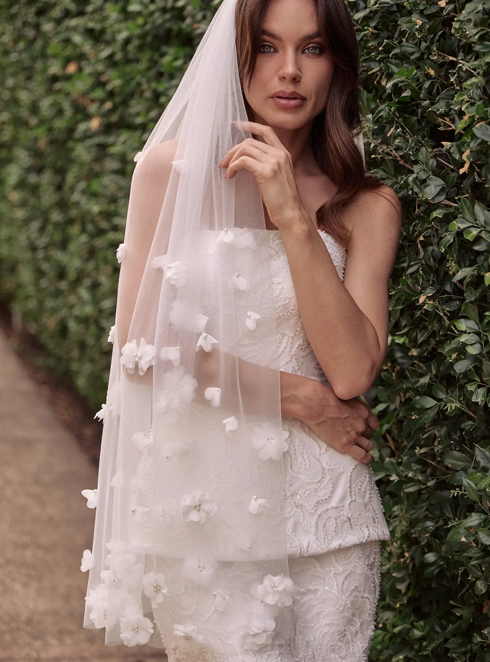 Romantic ivory pearl veil featuring delicate pearl accents for bridal ceremonies and wedding portraits