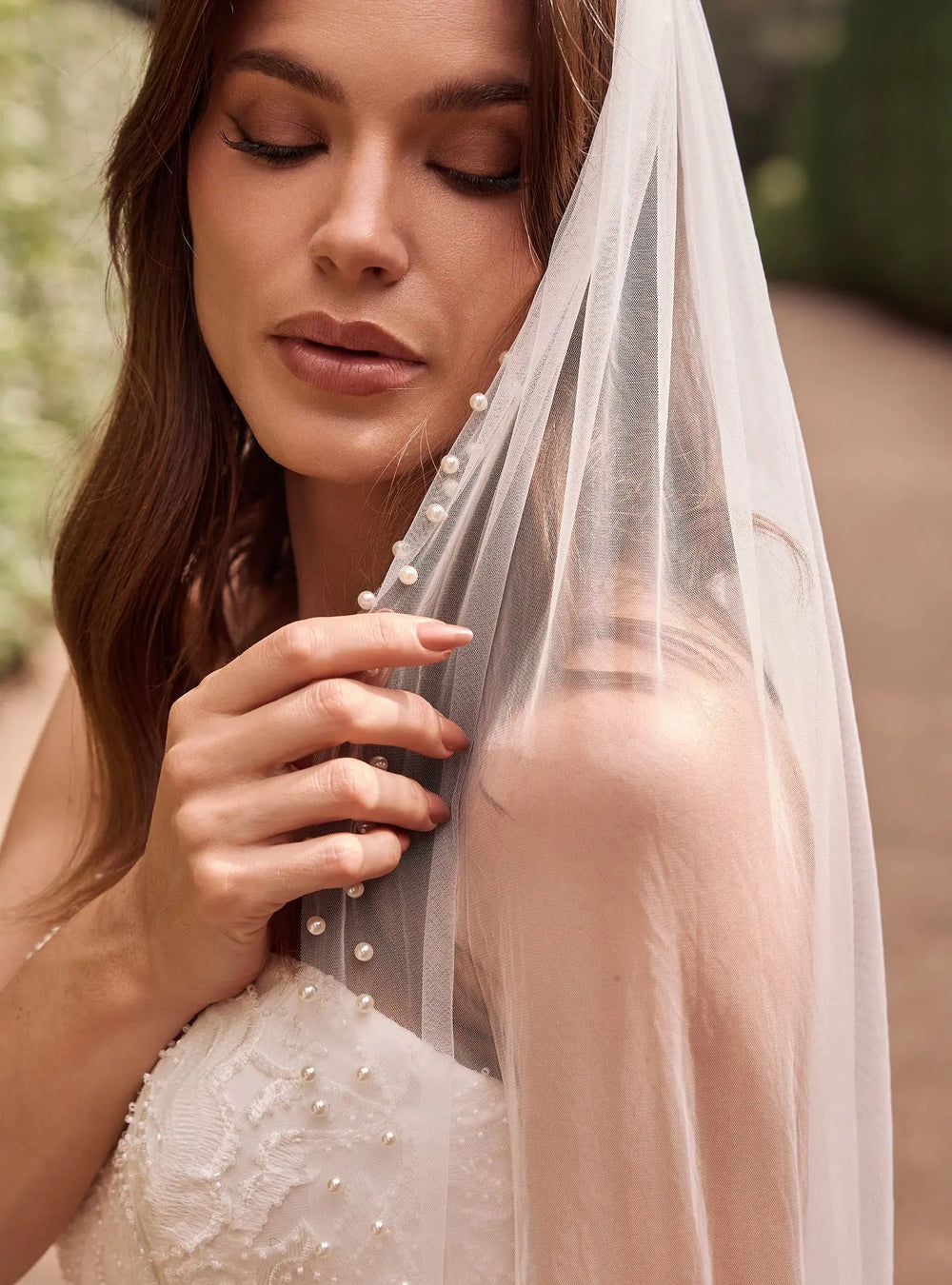 Ivory pearl cathedral veil with elegant pearl detailing for wedding ceremonies and bridal receptions
