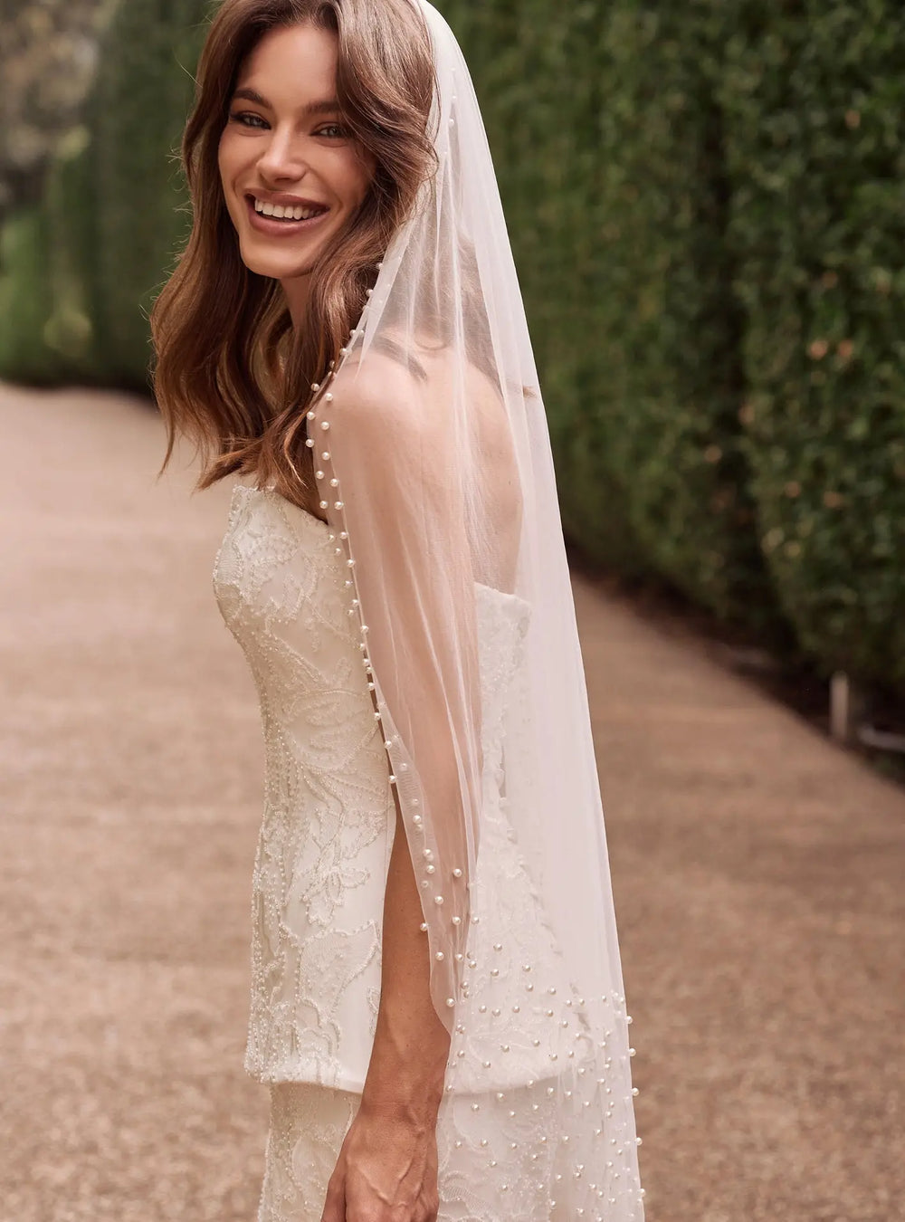 Ivory pearl bridal veil featuring delicate pearl embellishments and soft tulle for modern wedding styling by Lolaknight